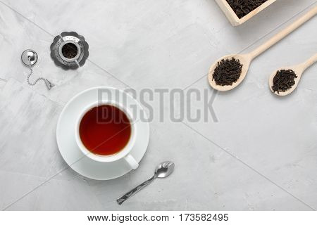 Cup Of Tea Silver Wooden Spoons Teapot On Concrete Background.