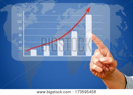 Business success and sales uptake chart with female hand and world map in the background