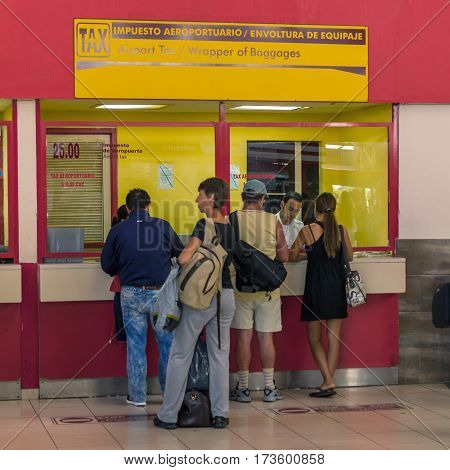 Havana, Cuba - April 2, 2012: Tourists In Hose Marti Airport Buying Special Sticker Tax