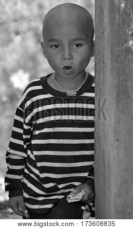 PHNOM PHEN, CAMBODIA MARCH 23: Unidentified street children posing on march 23 2013 in Phnom Phen,Cambodia.In Phnom Penh alone there are between 10,000 and 20,000 children live and work on the streets