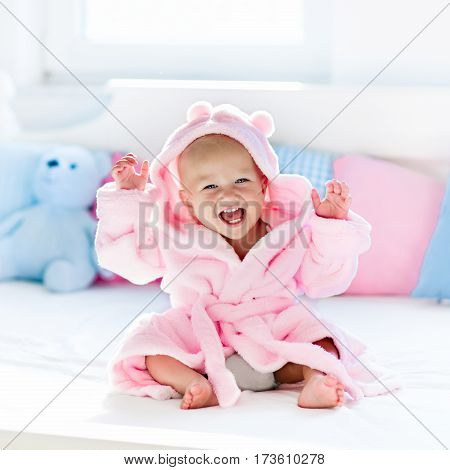 Baby In Bathrobe Or Towel After Bath