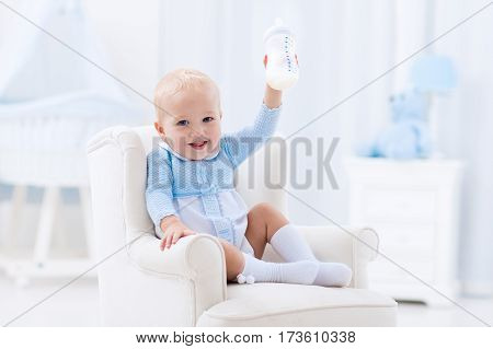 Baby Boy With Bottle Drinking Milk Or Formula