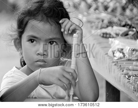 PHNOM PHEN, CAMBODIA MARCH 23: Unidentified street children posing on march 23 2013 in Phnom Phen,Cambodia.In Phnom Penh alone there are between 10,000 and 20,000 children live and work on the streets