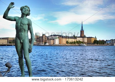 STOCKHOLM SWEDEN - AUGUST 20 2016: Song statues near Stockholm City Hall ( Stadshuset ) and View of Gamla Stan from Stockholm City Hall in Stockholm Sweden on August 20 2016.
