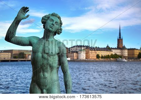 STOCKHOLM SWEDEN - AUGUST 20 2016: Song statues near Stockholm City Hall ( Stadshuset ) and View of Gamla Stan from Stockholm City Hall in Stockholm Sweden on August 20 2016.