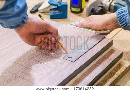 Assembling the kitchen drawer with a tray for the spoons and forks