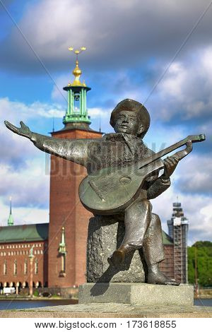 STOCKHOLM SWEDEN - AUGUST 19 2016: View of Evert Taube monument with guitar on Gamla stan in Stockholm Sweden in Stockholm Sweden on August 19 2016.