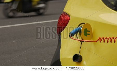 Power supply for electric car charging. City electric car charging station. Close-up.