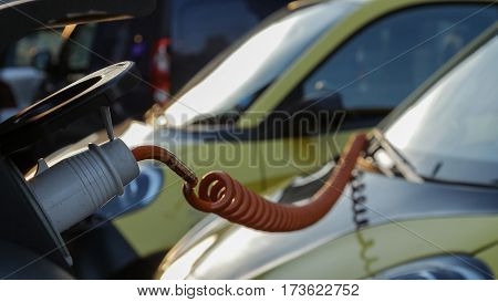 Power supply for electric car charging. City electric car charging station. Close-up.