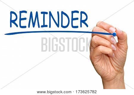 Reminder - female hand with blue marker writing text on white background