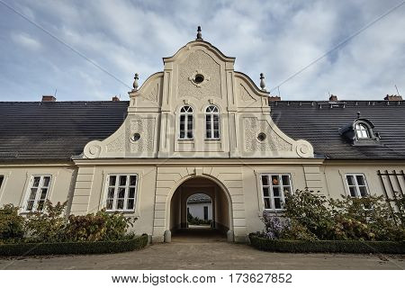 Autumn flowers in front of a historic house in Bad Muskau in Germany