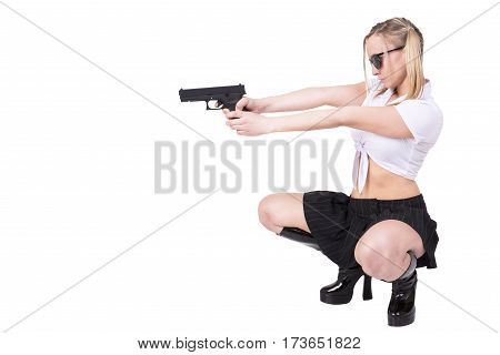 Sexy woman holding gun isolated on white background.