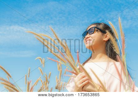 Girl And Feather Pennisetum