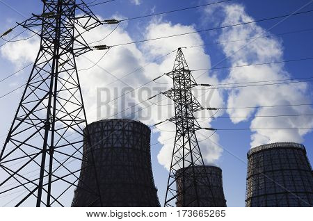 coolers with a smoke and columns against the blue sky