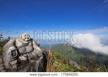 Sangkat Ja Buddha on the mountain with Twilight sky background
