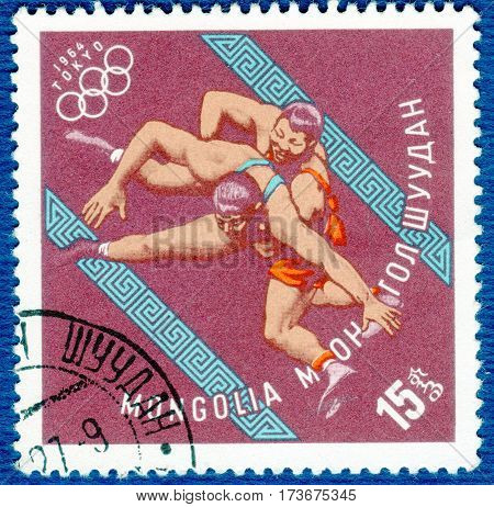MONGOLIA - CIRCA 1964: Postage stamp printed in Mongolia with a picture of a wrestling, with the inscription 
