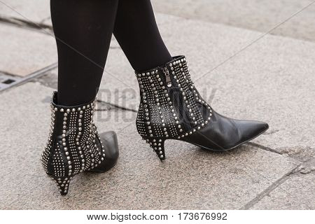 MILAN ITALY - FEBRUARY 23: Detail of shoes outside Genny fashion show during Milan Women's Fashion Week on FEBRUARY 23 2017 in Milan.