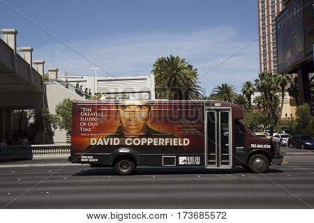 LAS VEGAS, NEVADA - MAY 10, 2014: Airline shuttle bus with David Copperfield advertisement on Las Vegas Strip in Las Vegas