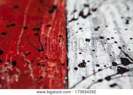 Patterned and textures background of brightly colored panels of weathered painted wooden boards. the flag of Indonesia