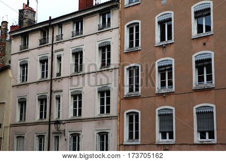 Windows with white wooden frames.The old house and the street in the historic center in Lyon, France