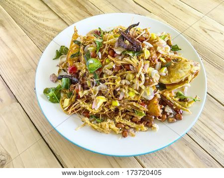 Fried fish with herb sauce spicy delicious food of Thailand.