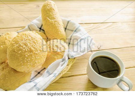 Breakfast with bread cheese sausage baloney sausage and coffee
