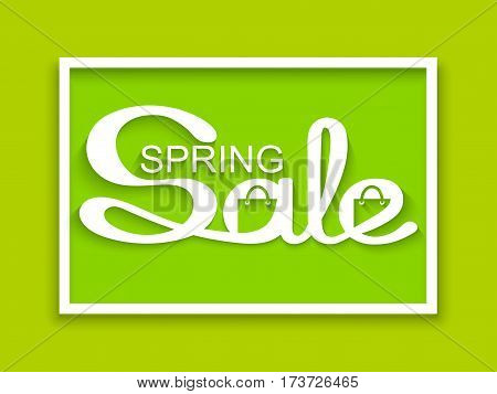 Spring sale. Sale banner with calligraphic inscription on green background. Vector illustration made in paper cut out style.