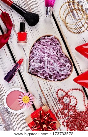 Accessories and cosmetics on wood. Things a woman needs.