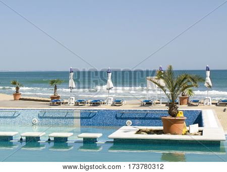 SAINT CONSTANTINE AND HELENA BULGARIA - APRIL 10 2015: Beach and swimming pool of Azalia hotel. Saint Constantine and Helena is the oldest first sea resort of Bulgaria exists from 19 century.