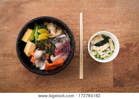Japanese Food Tekka Don Take Away On Wooden Background
