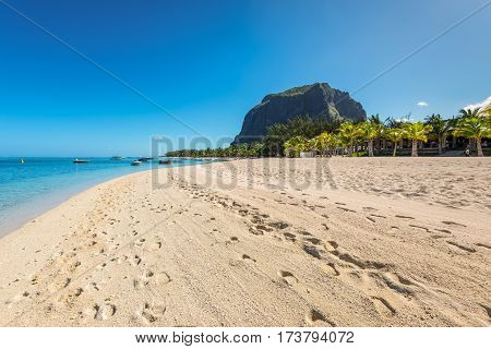 Le Morne Mauritius - December 11 2015: A wide-angle view on the Le Morne Beach one of the finest beaches in Mauritius. Le Morne Brabant mountain in the background.