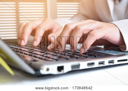 Data entryWomen key information into the computer.