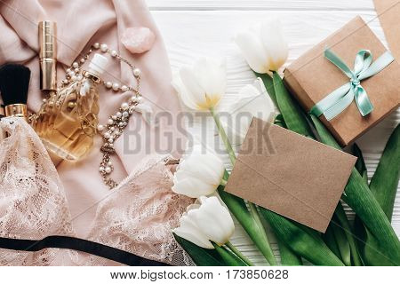 Woman Lace Lingerie Jewelry And Perfume Present On Soft Fabric And Tulips With Empty Greeting Card O