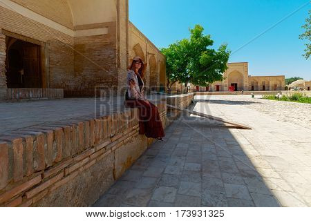 Tourist in ancient city - Bukhara, Uzbekistan, summer time