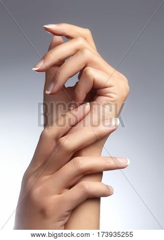 Beautiful Woman's Hands On Light Background. Care About Hand. Tender Palm. Natural Manicure, Clean S