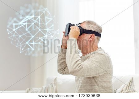 technology, augmented reality, gaming, entertainment and people concept - senior man in virtual headset or 3d glasses with low poly projection at home