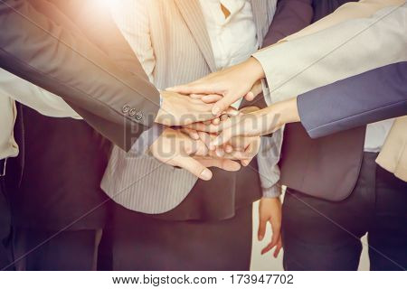 Success Teamwork Concept Business people joining hands city background.