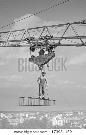 Developing city. Vertical monochrome shot of a retro builder at construction site professionalism vintage work worker engineering developer masculinity muscular athletic strength confidence concept