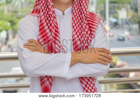 Arab businessman thinking or entrepreneur looking in the city