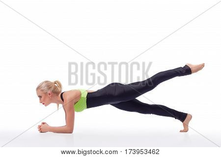 Core muscles burn. Studio shot of an attractive young blonde fitness woman working out doing planking exercise isolated copyspace gym fitness strength beauty body concept