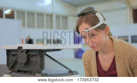 Concentrated woman playing mind control game. Future and technology concept