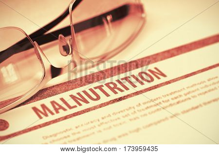 Malnutrition - Printed Diagnosis on Red Background and Spectacles Lying on It. Medical Concept. Blurred Image. 3D Rendering.