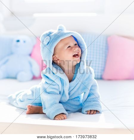 Baby In Bathrobe Or Towel After Bath