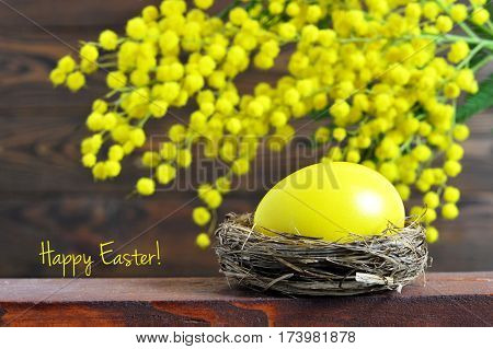 Happy Easter card: Easter egg and mimosa