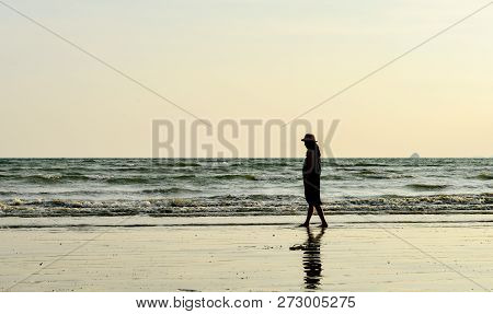 Single Young Woman On Beach When Sunset