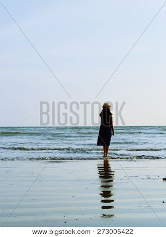 Single Young Woman On Beach When Sunset