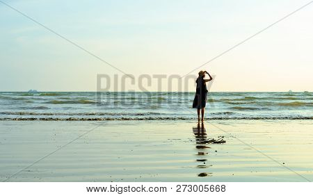 Single Young Woman On Beach When Sunset