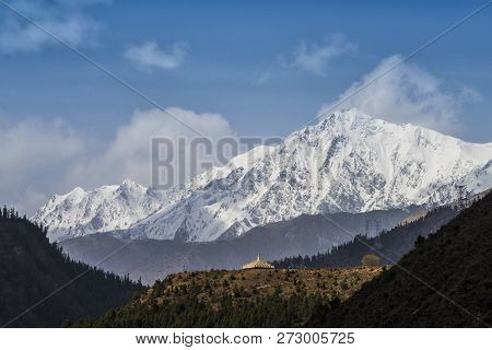 Scenic View With The Beautiful Mountain Peaks With Snow And Glaciers, Slopes Covered With Stupa Or P