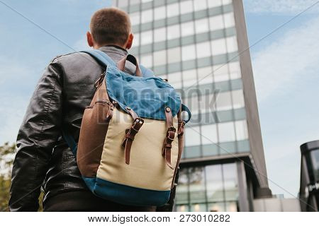 A Tourist With A Backpack Or A Guy Arrived To Check Into Apartments Or Watch Sights In A Big City Or