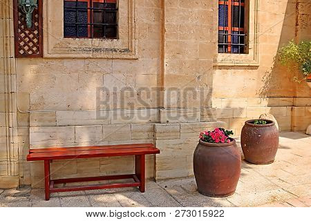 Bench And Wine Bowls With Flowers Near The Cana Greek Orthodox Wedding Church In Cana Of Galilee, Kf